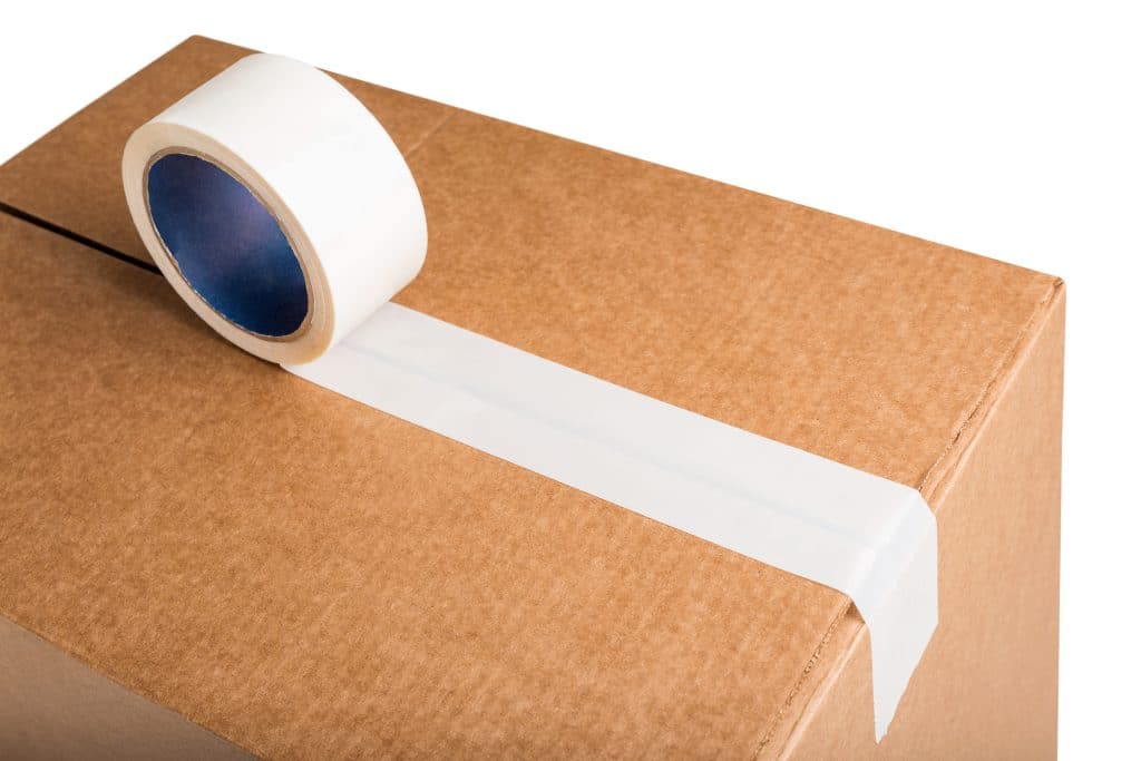 Person taping a box shut.