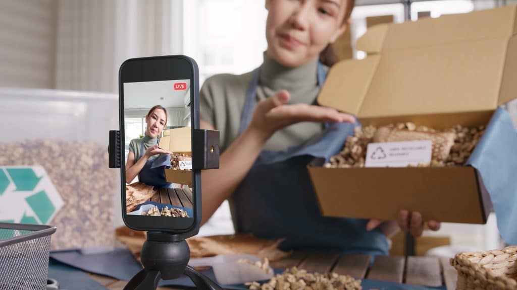 A woman promoting products on a live stream