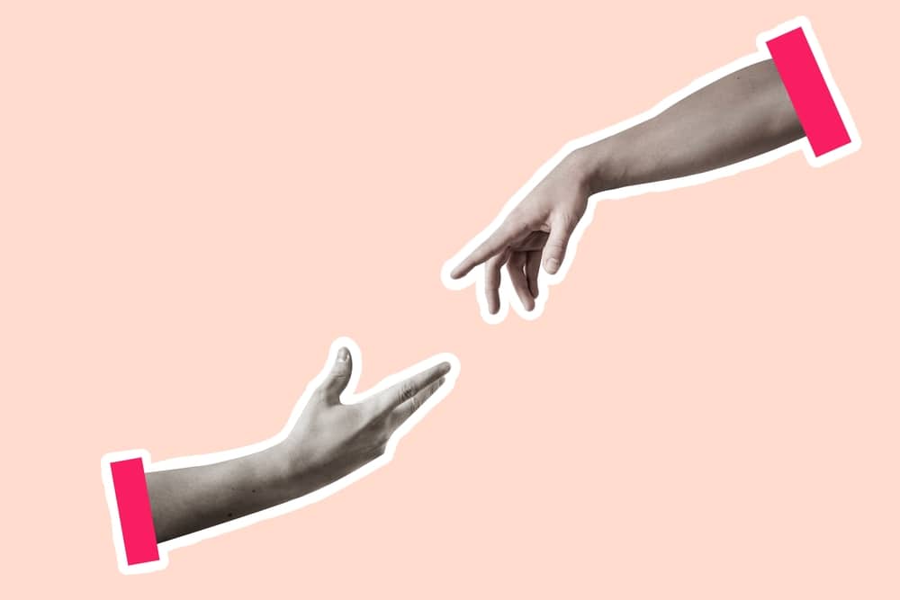 two hands reaching out to each other
