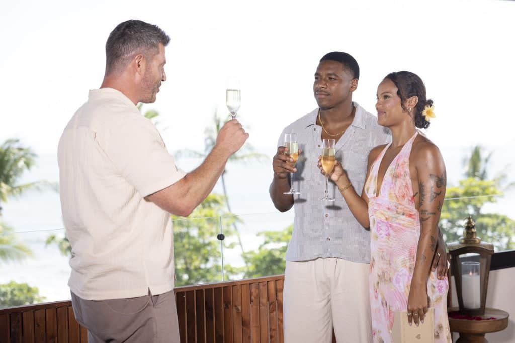 Jesse, Alexe, and Andrew drinking champagne.