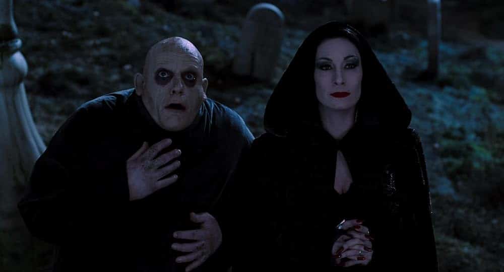 Christopher Lloyd and Anjelica Huston as Uncle Fester and Morticia Addams in 'The Addams Family.'