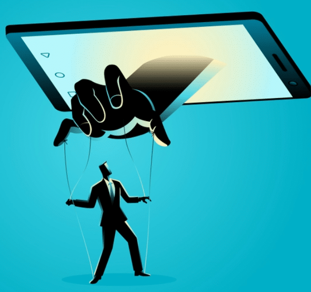 Image of a hand reaching from a cellphone to hold the puppet strings of a person in a suit.