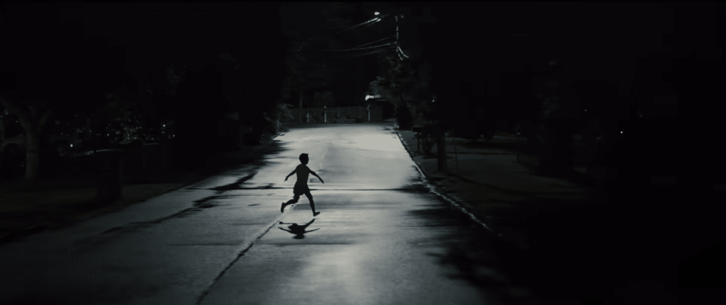 A Child Running Through The Street In Weapons Movie. Credit: Warner Bros