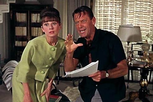 Audrey Hepburn in the green tweed suit in Paris When It Sizzles (Credit: IMDb)