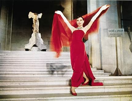 Audrey Hepburn wearing a ruby gown in Funny Face (Credit: IMDb)