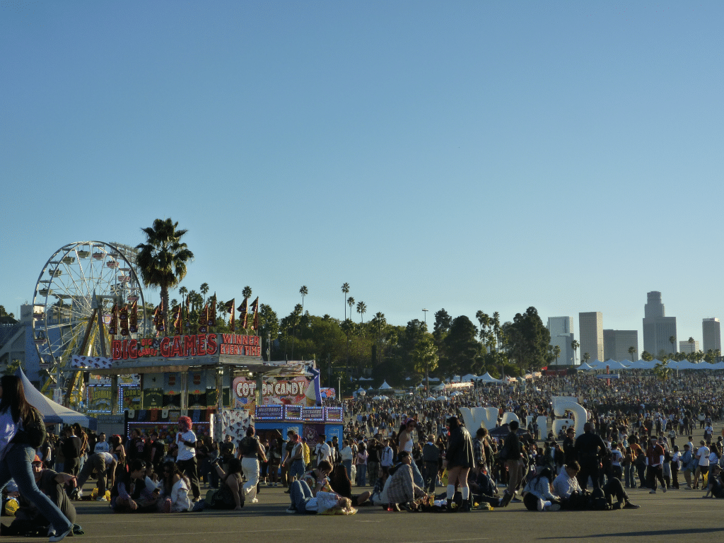 Crowd at Camp Flog Gnaw music festival 2024 with Los Angeles skyline