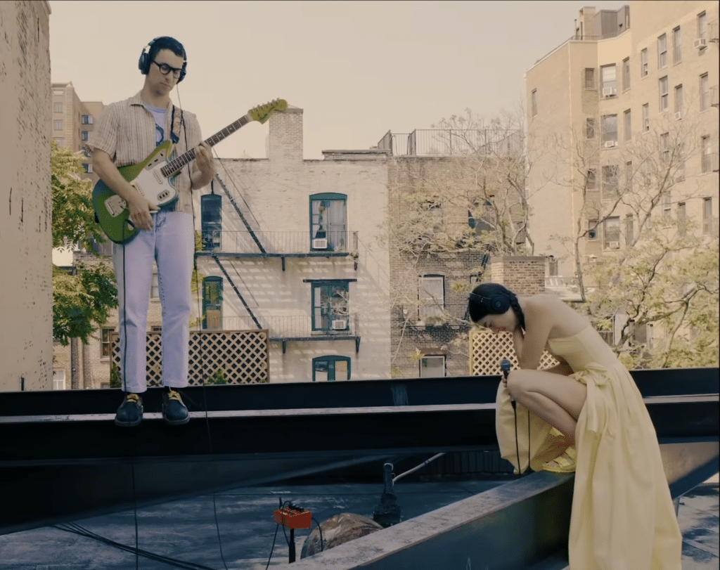 Jack Antonoff and Lorde performing "Dominoes".