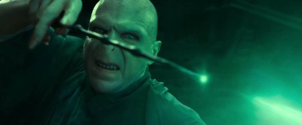 The villain, Voldemort casting a green spell