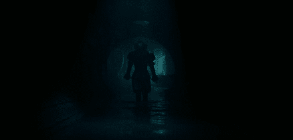Pennywise, an evil clown, staring at the camera in a dark sewer