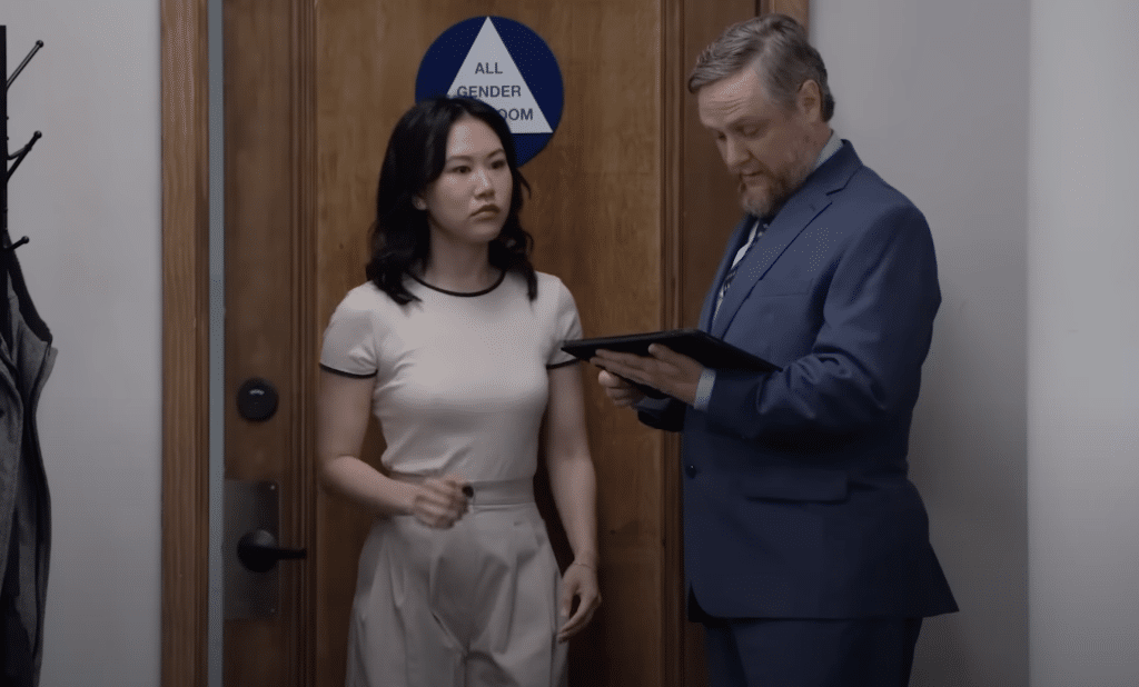 Ken stops Nicole outside the bathroom.