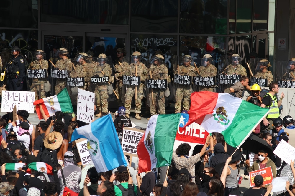 California National Guard watching protesters in Los Angeles.