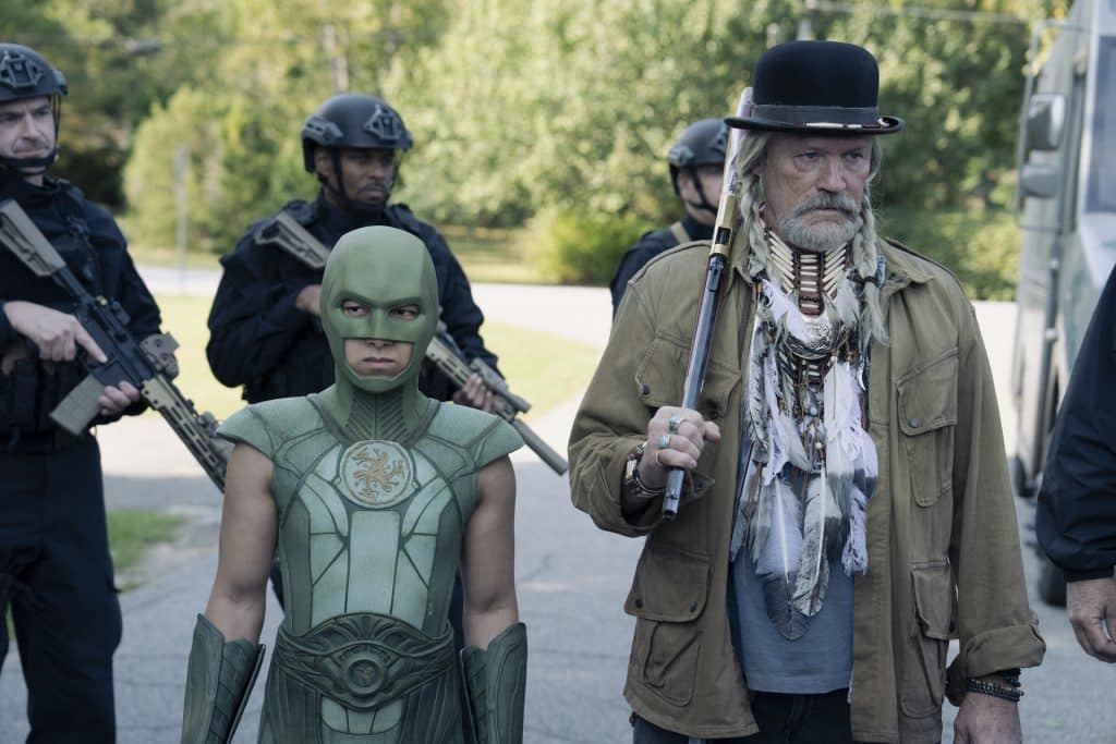 Judomaster (Nhut Le) and Red St. Wild (Michael Rooker) surrounded by A.R.G.U.S. agents.
