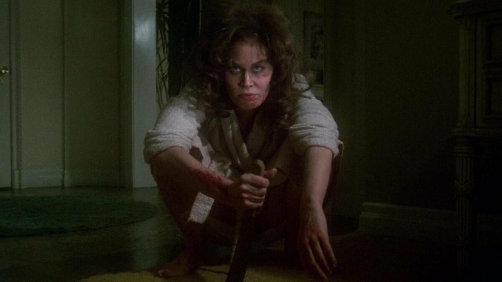 Amelia (Karen Black) waits to attack after being possessed by the killer Zuni fetish doll in Trilogy of Terror.