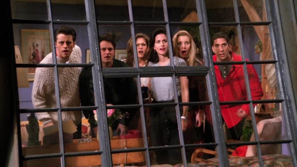 Friends characters gather around window