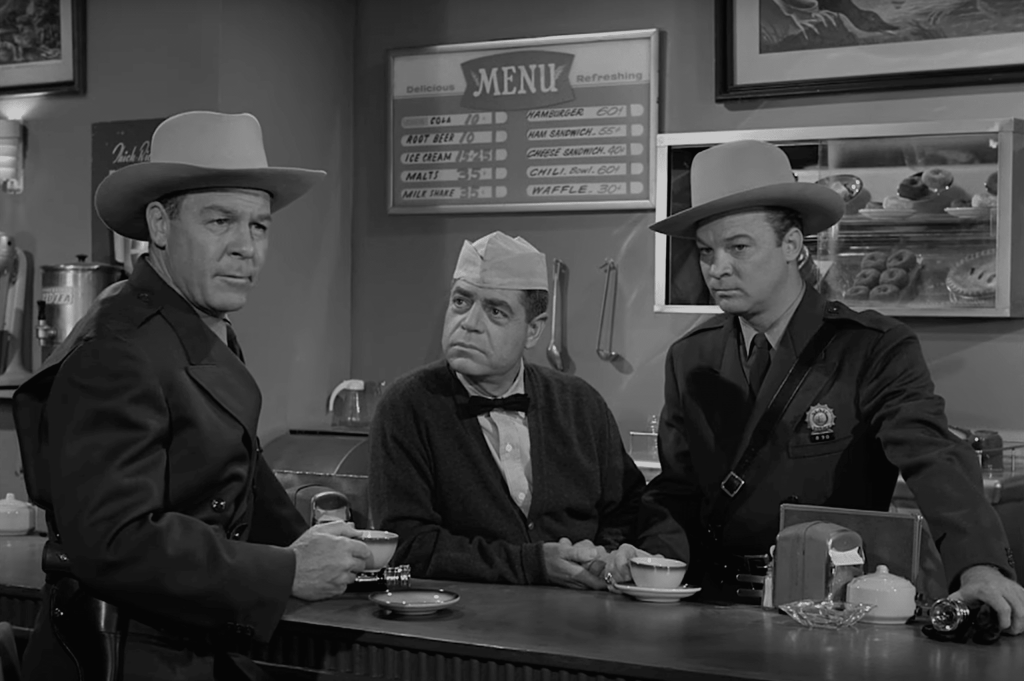 Police troopers investigating at a diner