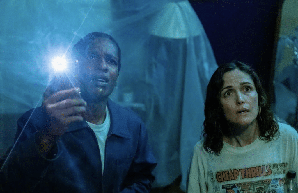 A$SAP Rocky and Rose Byrne look up. (Credit: A24).
