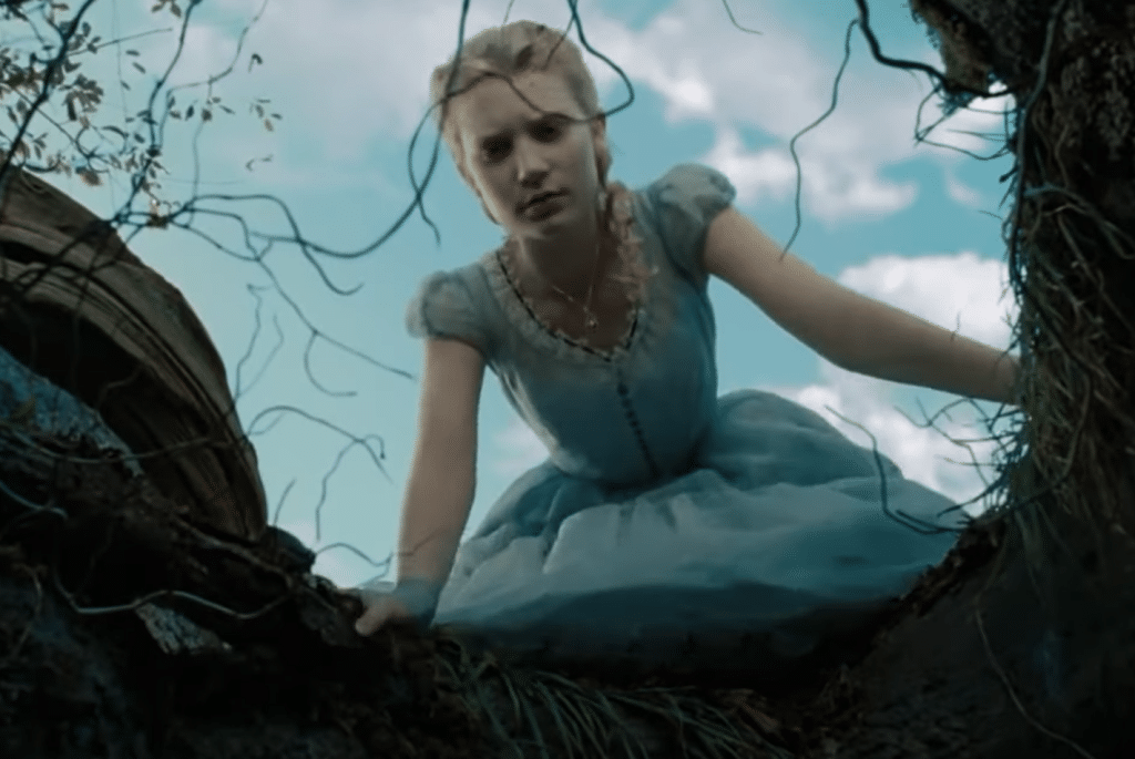 Alice looking down into a large rabbit hole. Credit: YouTube/Alice in Wonderland