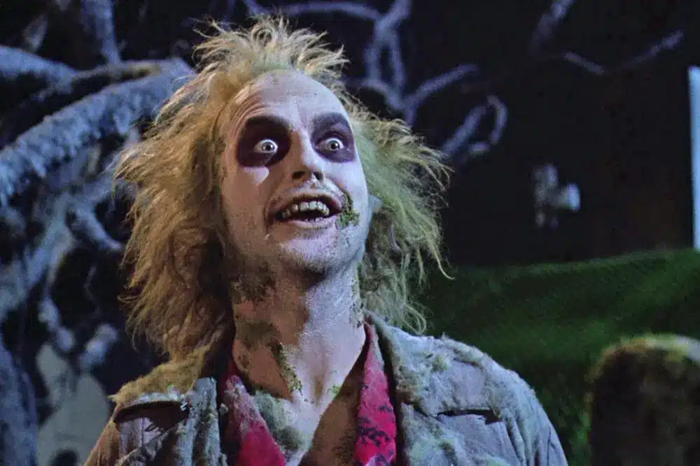 michael keaton as beetlejuice staring wide-eyed into the camera