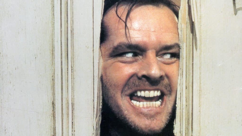 jack nicholson in the shining peeking through bathroom door