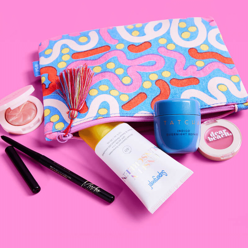 Standard Ipsy Glam Bag with sunscreen, lip care, blush, and eyeliner.