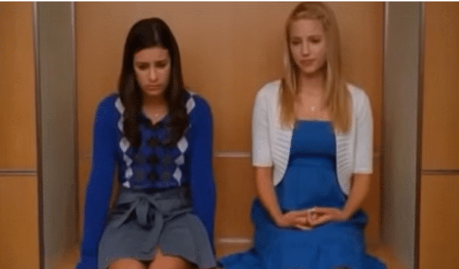 Two girls sat on a bench