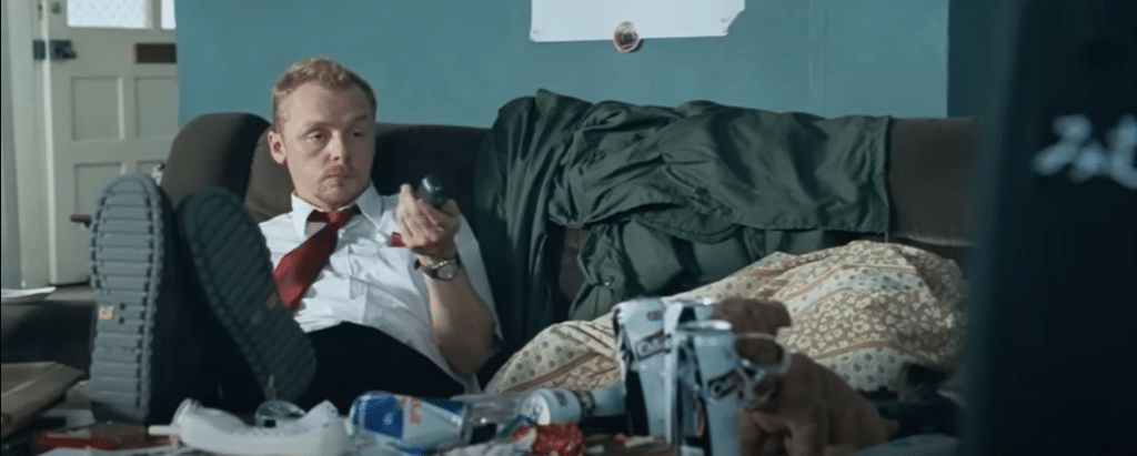 Shaun is on his couch, surrounded by crushed cans and more trash. Shaun's ADHD can be shown by the disorganization around him.