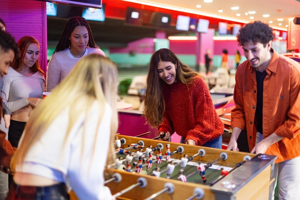 A group of friends playing table football