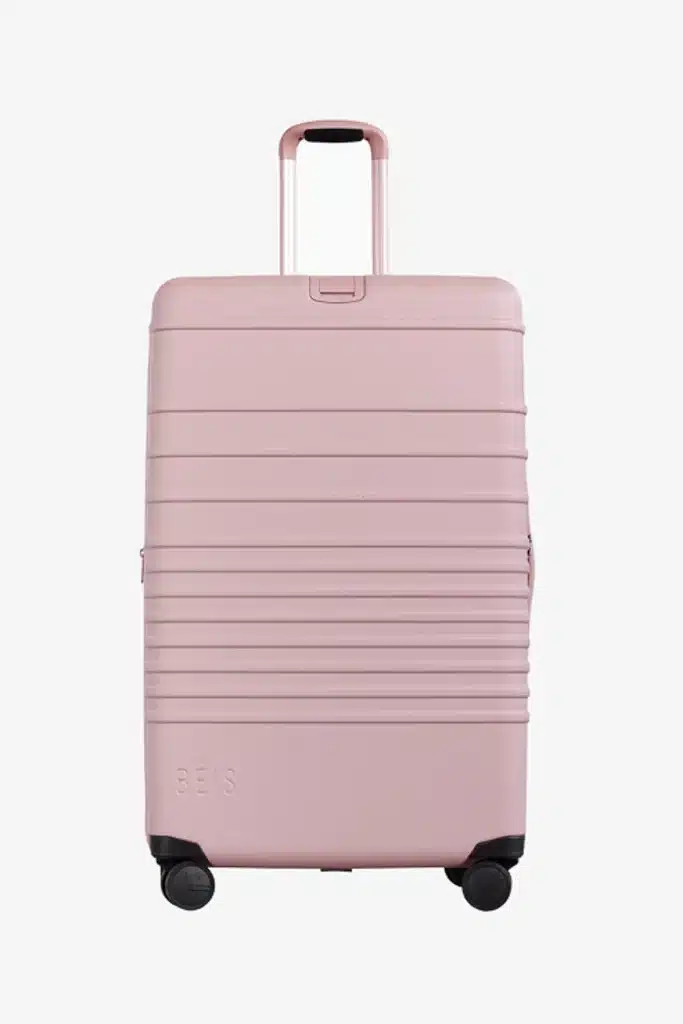 pink suitcase on white background