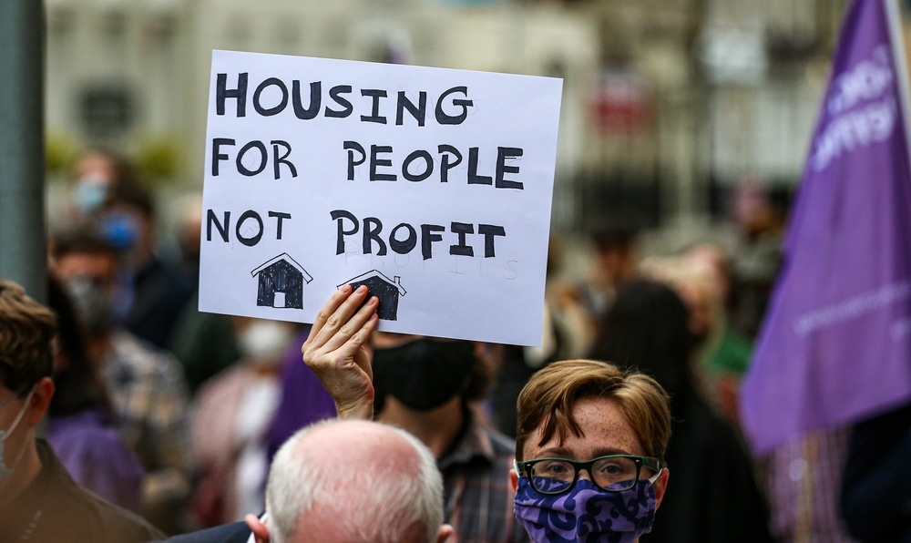 Protesters rally for housing reform, demanding that homes be treated as a right, not a commodity. (Image: Shutterstock)