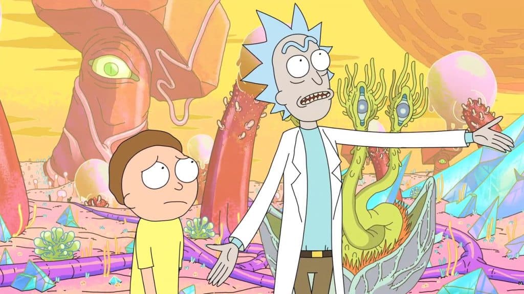 Animated characters Rick and Morty in a colourful universe after being transported there through a portal.