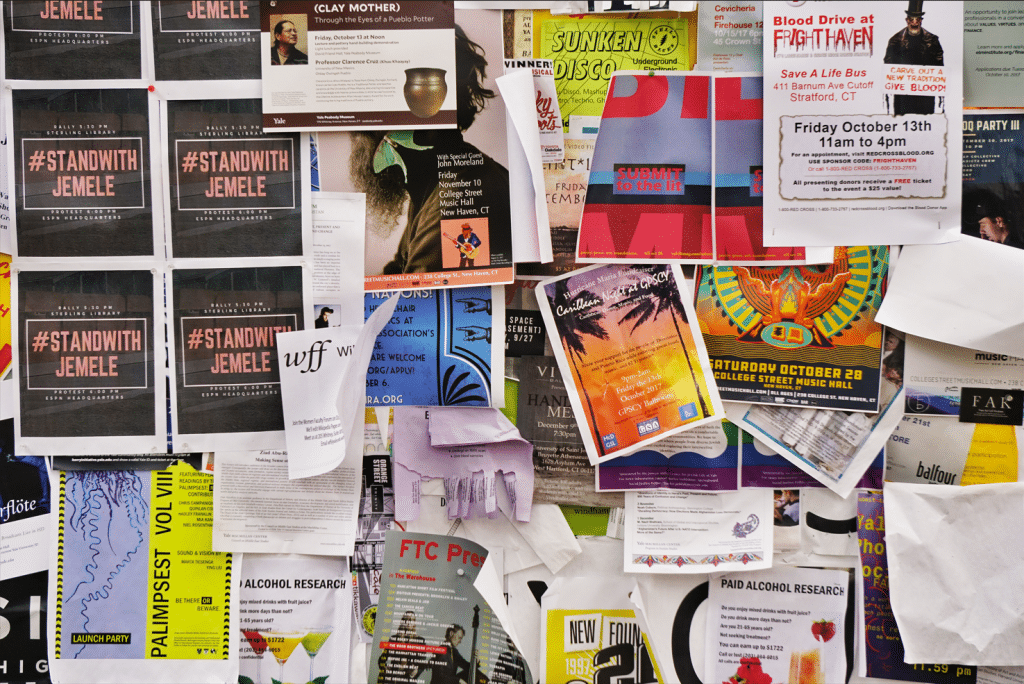 Bulletin board with college club flyers on it