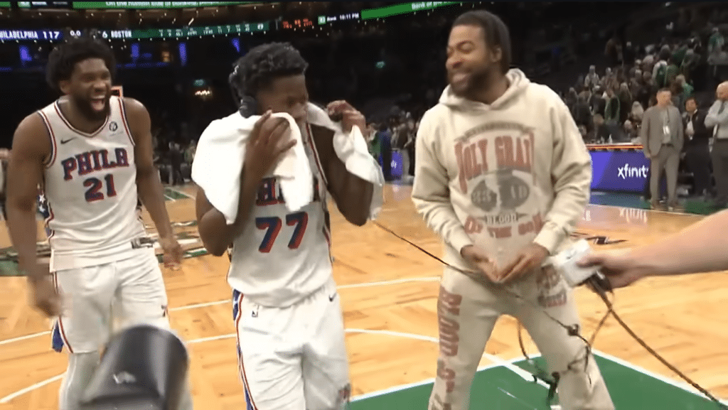 Rookie VJ Edgecombe gets doused by teammates after scoring 34 points in his historic debut vs. Boston.