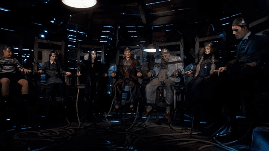 The Addams family strapped into chairs