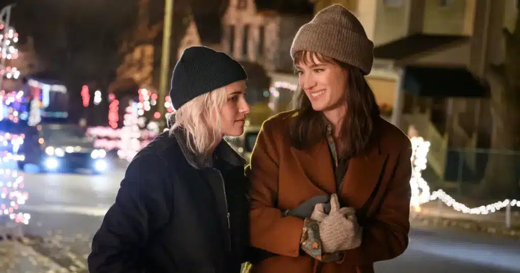 Kristen Stewart and Mackenzie Davis as Abby and Harper in the lesbian holiday romance film, "Happiest Season". (Image: Hulu).