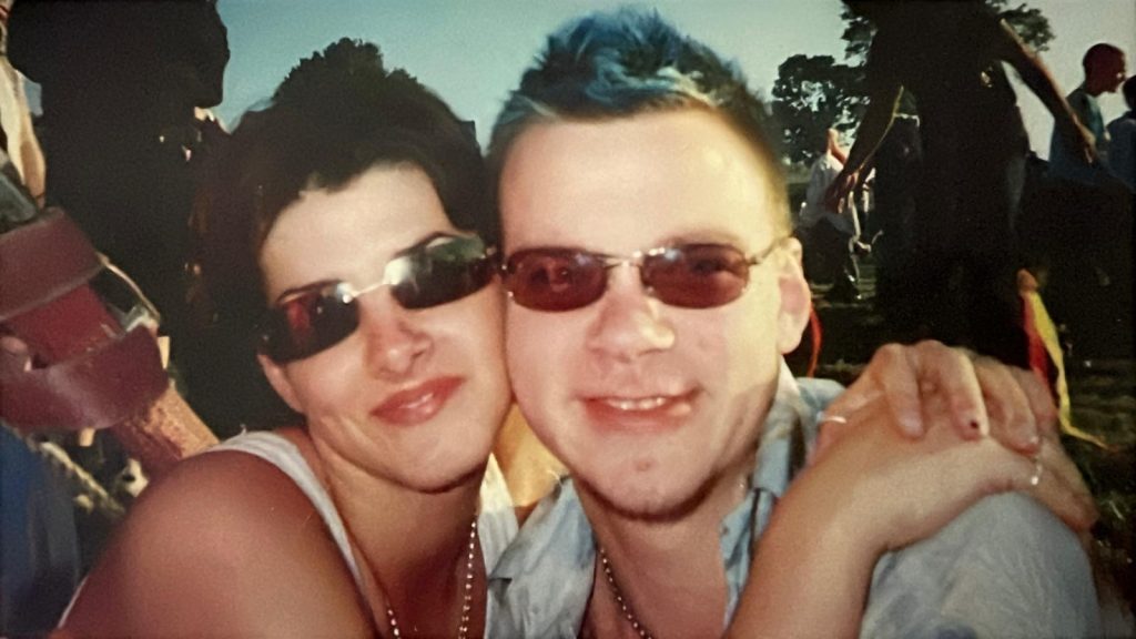 Em Conti in the 90s hugging her friend David at an event