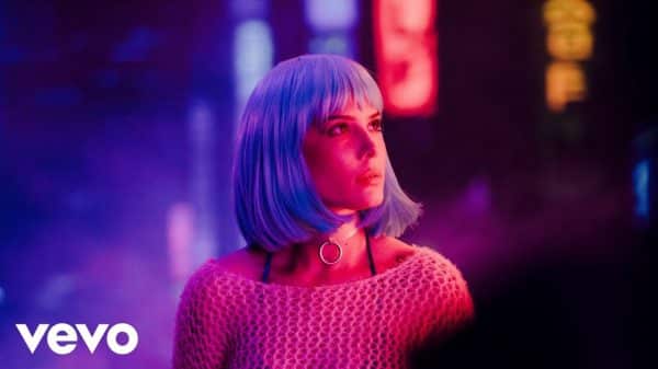 Halsey recreates her "Badlands" era look with a bright blue wig in the newly released "Drive" music video.