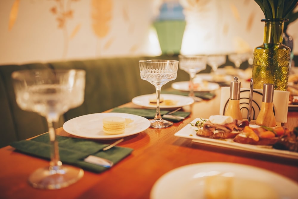 glassware and place settings set up for a meal