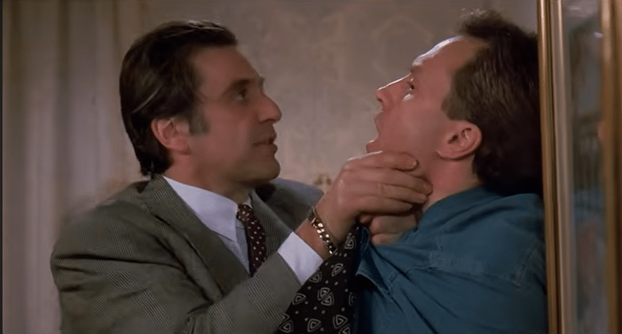 Al Pacino with his hands at another man's throat