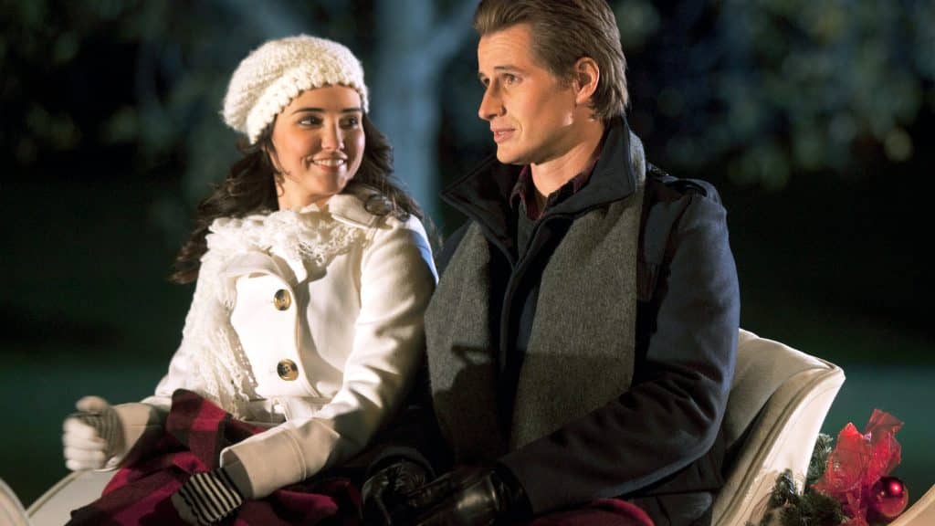 Wendy and her stranger sitting on a carriage together.