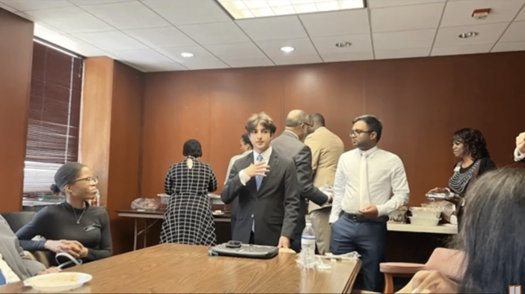 Akbar Ali stands at a Gwinnett County Democrats meeting.