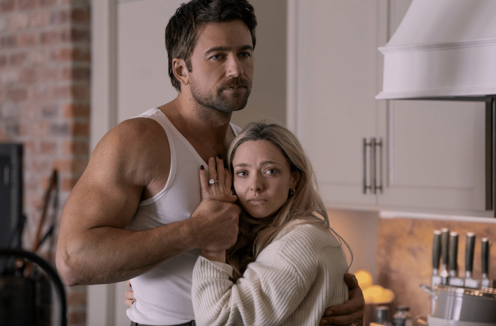 Nina (amanda Seyfried) cries in her husband's arms in the housemaid
