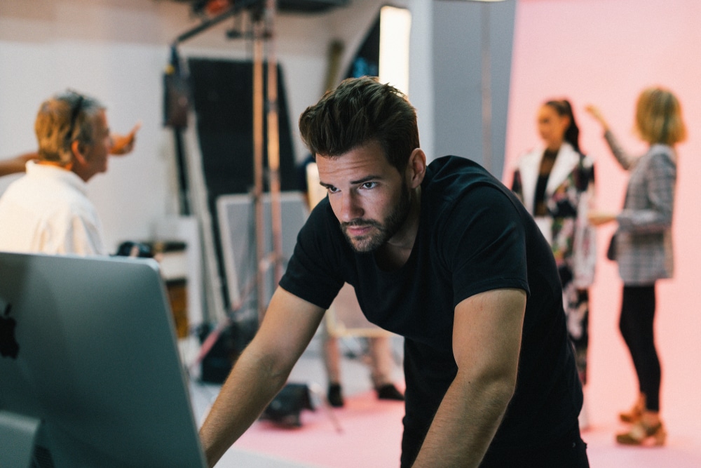 Art director checking photos on a monitor.