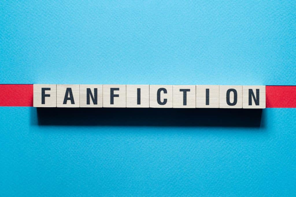 Scrabble shaped squares spelling out the word FanFiction with a blue background (Shutterstock/ Sergio Vas)