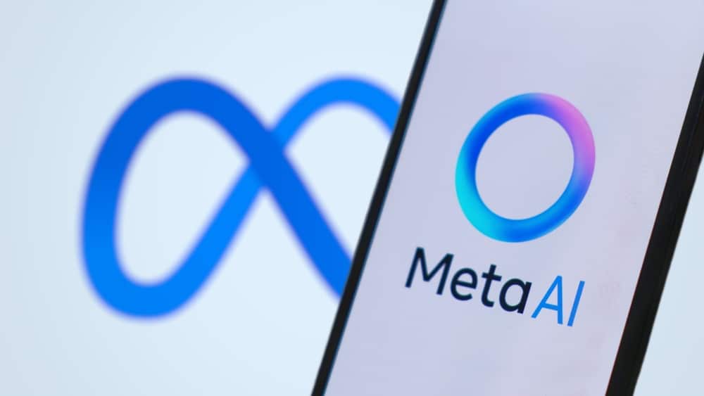 The Meta logo on a computer screen, and it's AI equivalent on a mobile phone.