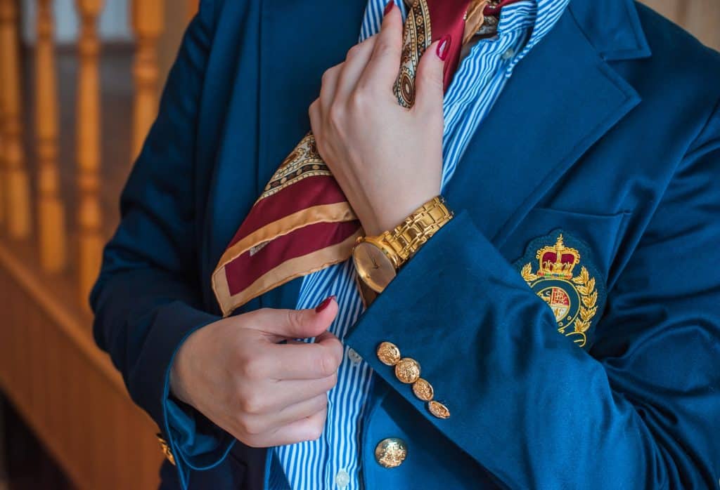 A woman wearing formal attire with gold accents