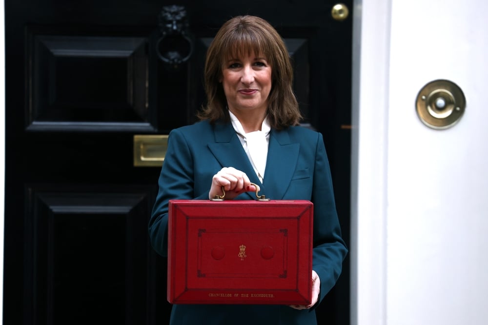 UK Chancellor Rachel Reeves holding a red briefcase in Downing Street on Budget day.
