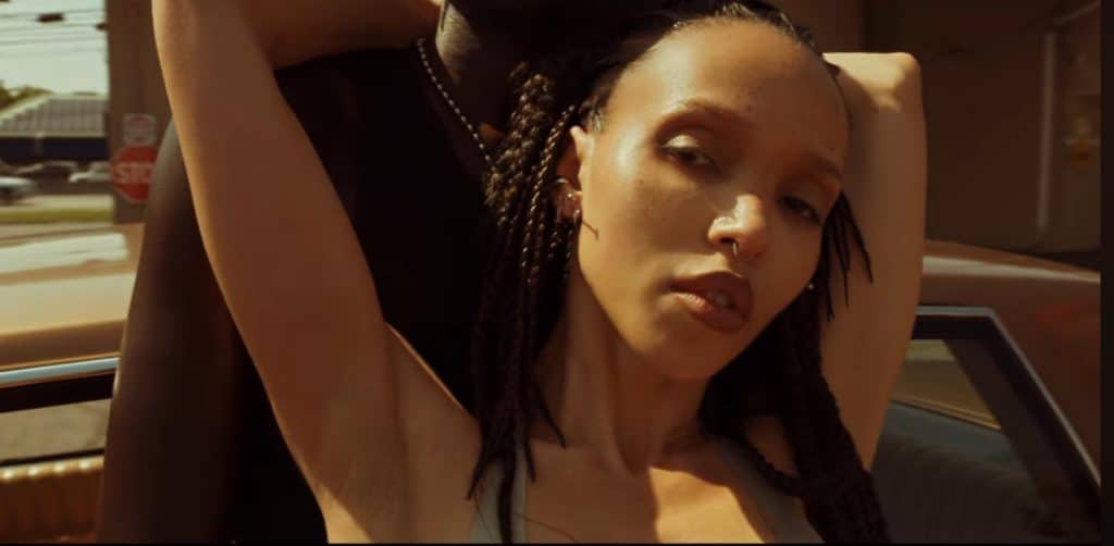 FKA twigs dances with partner in music video.