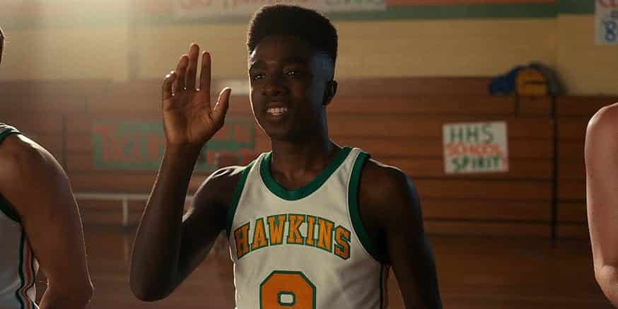 Lucas Sinclair from stranger things, pictured waving.