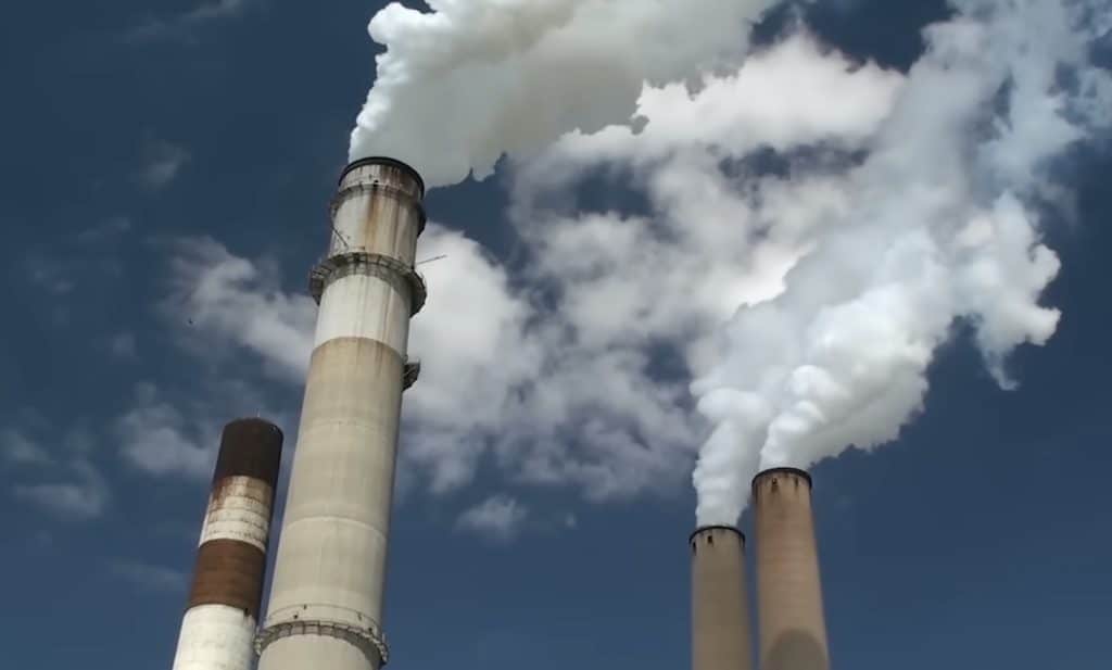 A factory releasing fossil fuels into the atmosphere