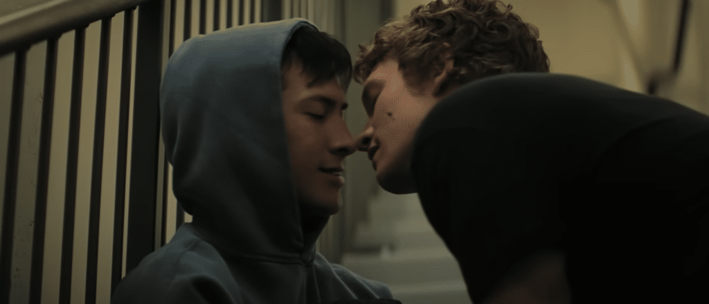 Two main characters of the show in a stairwell, face-to-face